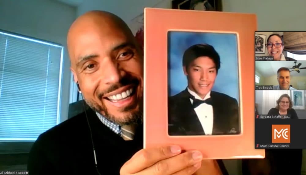 Michael Bobbitt, selected Friday as the new executive director of the Massachusetts Cultural Council, held up a photo of his son, Sang, as he introduced himself to the council's governing board during a Zoom call. (Screenshot/State House News Service)