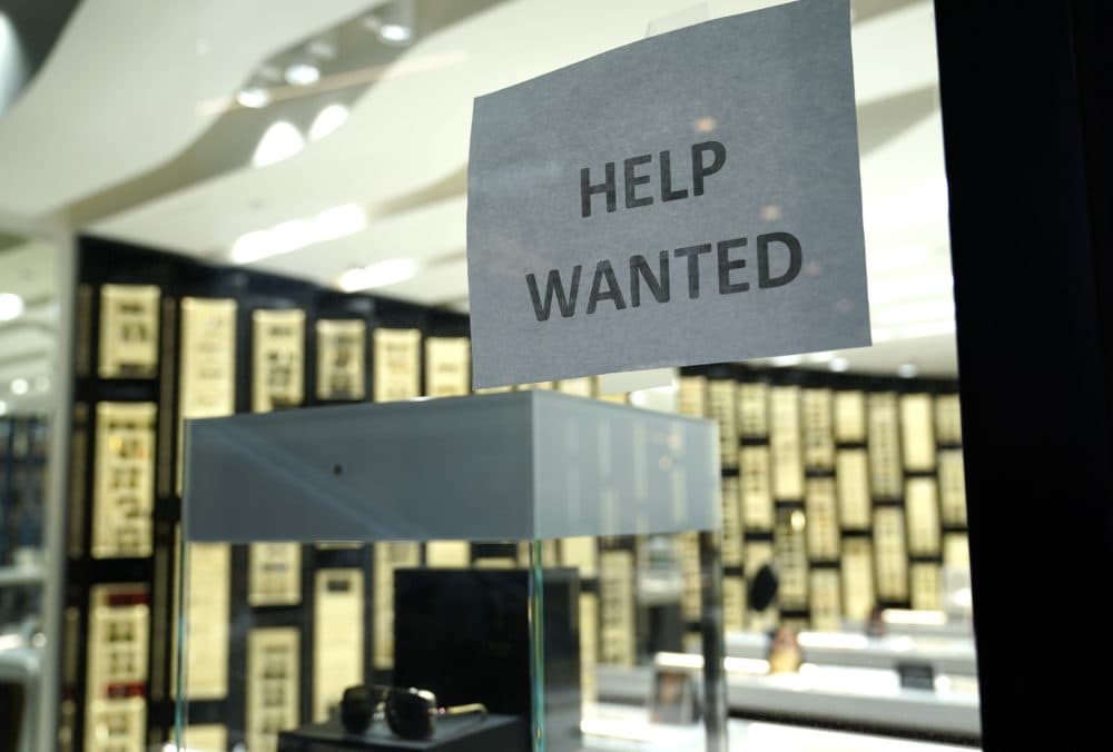 A Help Wanted sign is posted at a Designer Eyes store at Brickell City Centre, Friday, Nov. 6, 2020, in Miami.(Lynne Sladky/AP)