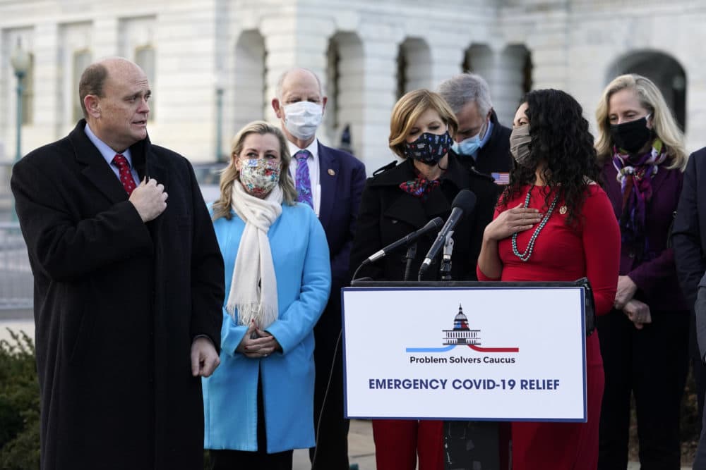 Members of the Problem Solvers Caucus addressed reporters on Capitol Hill Monday, before Congress passed a $900 billion coronavirus relief bill. (Jacquelyn Martin/AP)