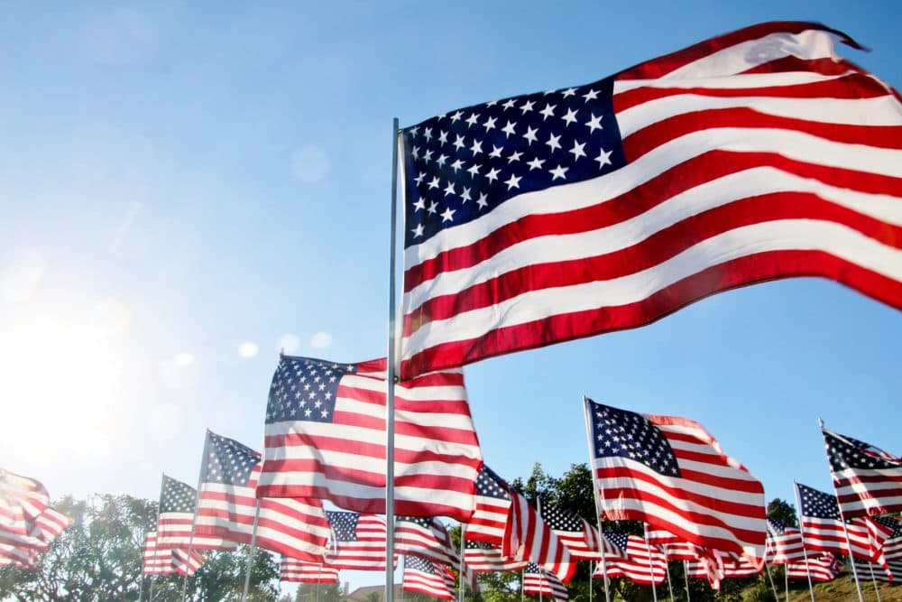 U.S. flags blow in the wind in Malibu, California. (Getty Images)