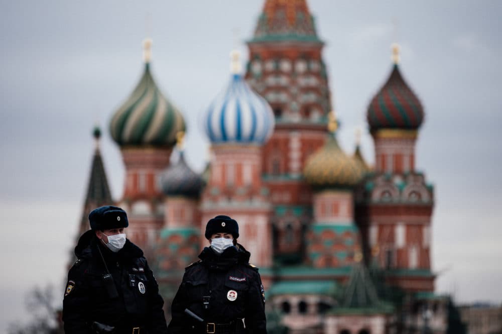 Russian police officers patrol on March 30, 2020 on the deserted Red square in front of Saint Basil's Cathedral in Moscow as the city and its surrounding regions imposed lockdowns. (Dimitar Dilkoff/AFP/Getty Images)