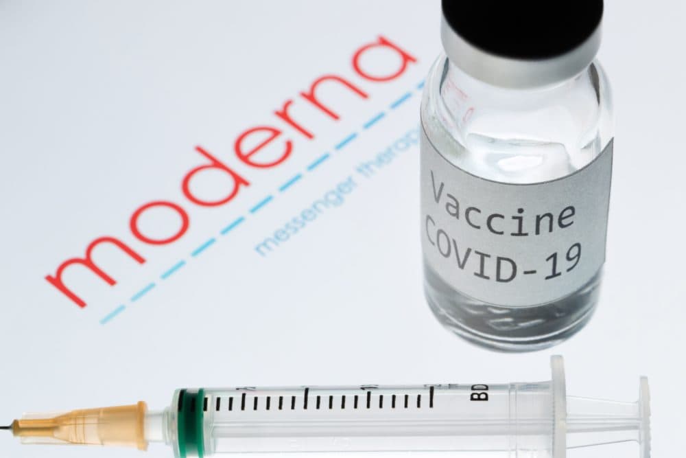 A syringe and a bottle reading &quot;Vaccine COVID-19&quot; next to the Moderna biotech company logo. (Joel Saget/AFP via Getty Images)