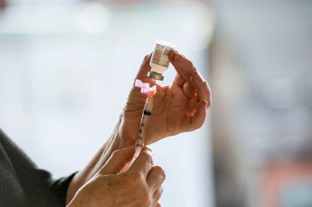 Syringe with the Moderna COVID-19 vaccine at the East Boston Neighborhood Health Center in Boston on Dec. 24, 2020. (Joseph Prezioso/AFP via Getty Images)