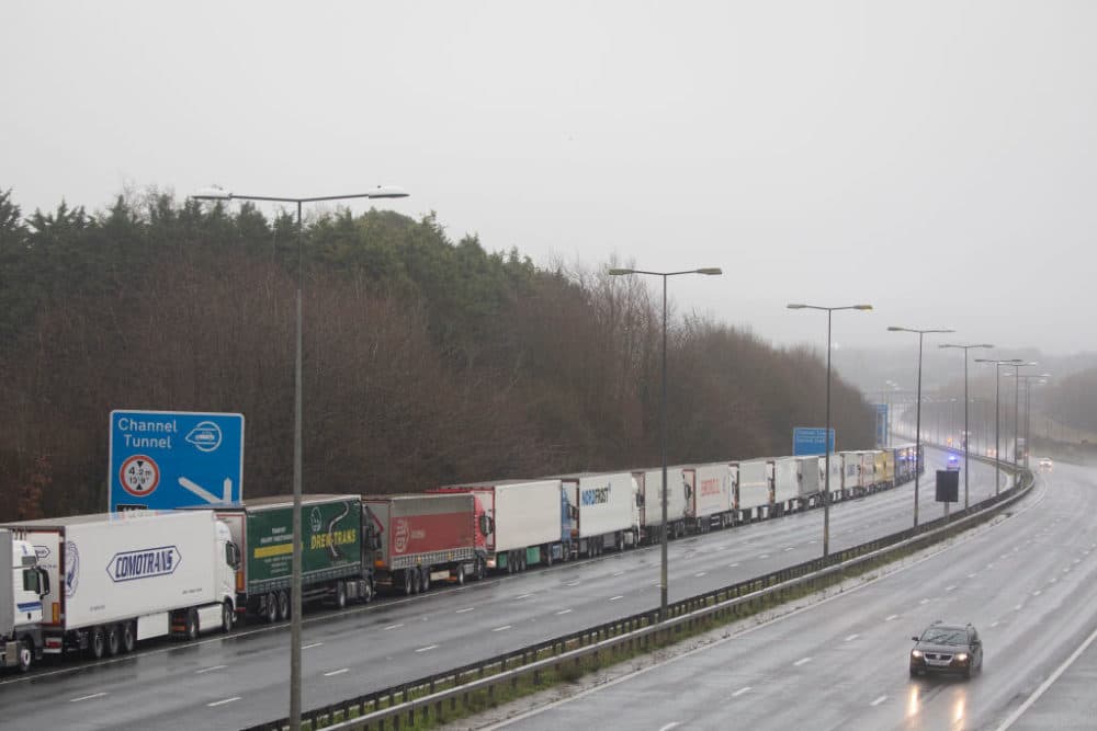 Trucks queue during operation stack toward Dover, England, on December 21, 2020. Citing concern over a new COVID-19 variant and England's surge in cases, France temporarily closed its border with the UK late Sunday, halting freight and ferry departures from the port of Dover for 48 hours. (Dan Kitwood/Getty Images)