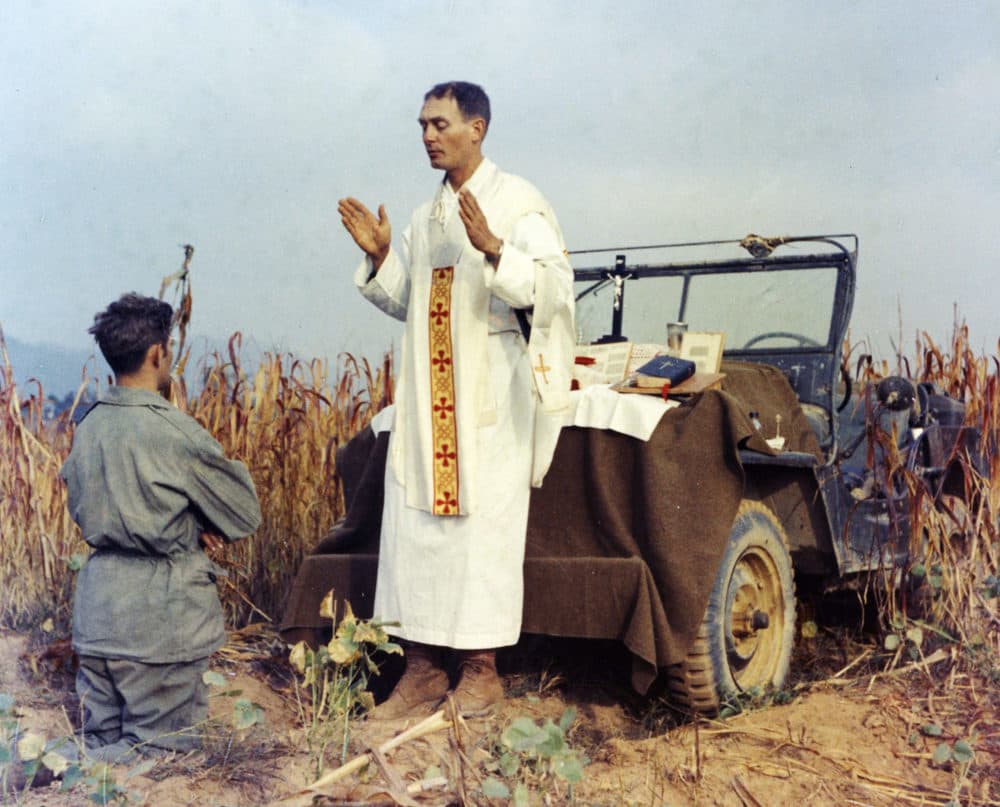 Father Emil Kapaun celebrates Mass using the hood of his jeep as an altar, as his assistant, Patrick J. Schuler, kneels in prayer in Korea on Oct. 7, 1950, less than a month before Kapaun was taken prisoner. Kapaun died in a prisoner of war camp on May 23, 1951, his body wracked by pneumonia and dysentery. On April 11, 2013, former President Barack Obama awarded the legendary chaplain, credited with saving hundreds of soldiers during the Korean War, the Medal of Honor posthumously. (U.S. Army Col. Raymond A. Skeehan)