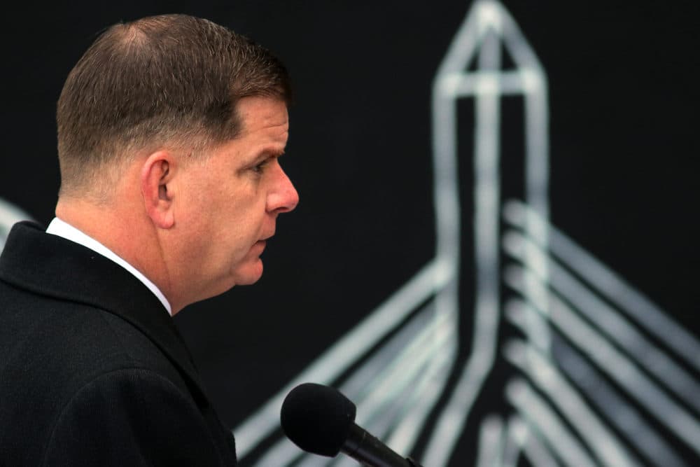Mayor Marty Walsh gives updated information concerning the COVID-19 pandemic at a press conference outside City Hall in Boston on Dec. 3. (Lane Turner/The Boston Globe via Getty Images)