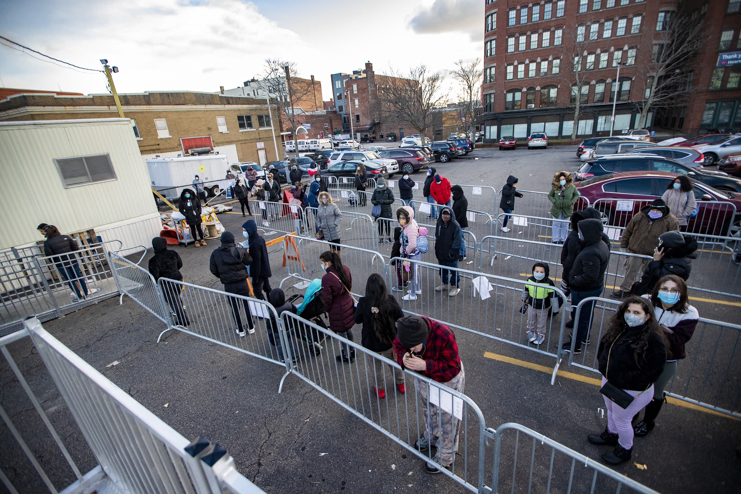 People wait in line for COVID-19 testing at the Lynn Community Health Center on Monday. (Jesse Costa/WBUR)
