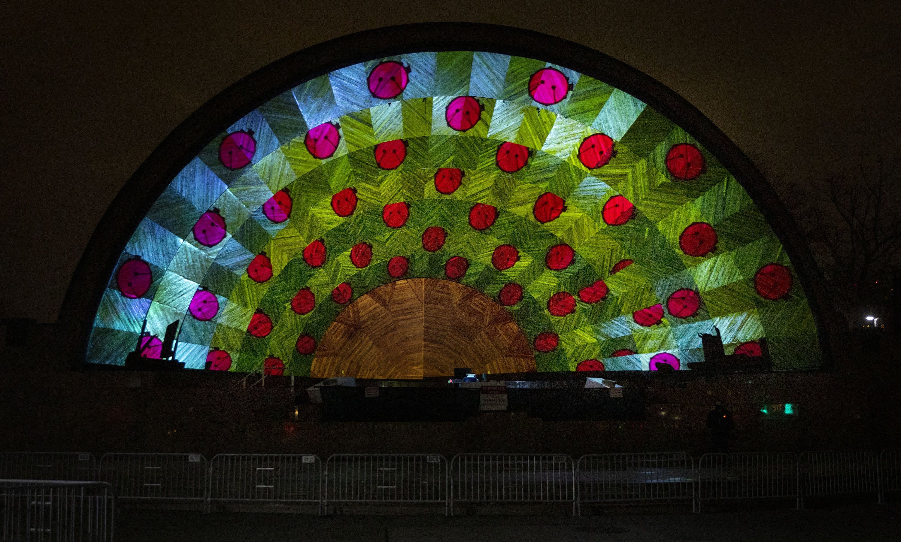 The Hatch Shell, lit up with patterns and drums, as the artist team sets up &quot;Hatched: Breaking through the Silence.&quot; (Robin Lubbock/WBUR)