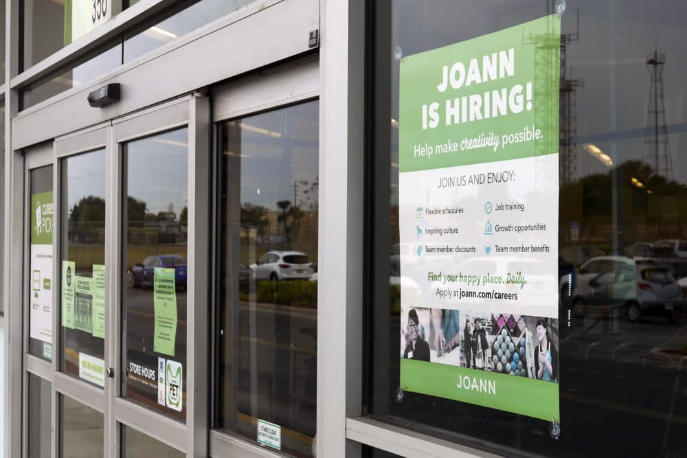 A sign advertising job openings at a JOANN fabric and craft store is displayed near the entrance, Tuesday, Jan. 12, 2021, in Orlando, Fla. (John Raoux/AP)