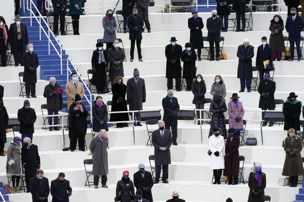 People attend the 59th Presidential Inauguration at the U.S. Capitol in Washington, Wednesday, Jan. 20, 2021. (AP Photo/Carolyn Kaster)
