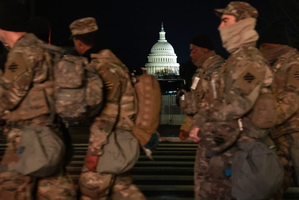 Military personnel march outside the Capitol as security is increased ahead of the inauguration of President-elect Joe Biden and Vice President-elect Kamala Harris, Wednesday, Jan. 20, 2021, in Washington. (AP Photo/John Minchillo)