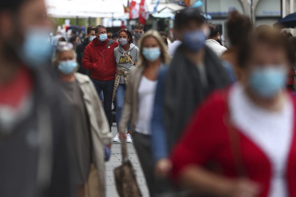 People wear face masks as they walk through the city center in Munich, Germany, Thursday, Sept. 24, 2020. (Matthias Schrader/AP)