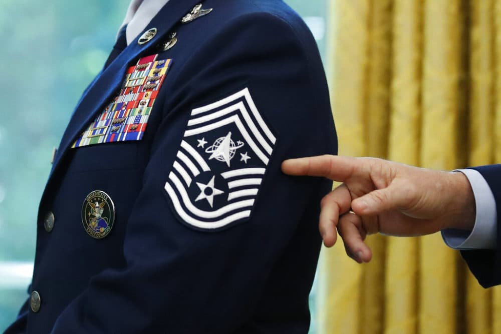 Chief Master Sgt. Roger Towberman displays his insignia during a presentation of the United States Space Force flag in the Oval Office of the White House in Washington. (AP Photo/Alex Brandon, File)