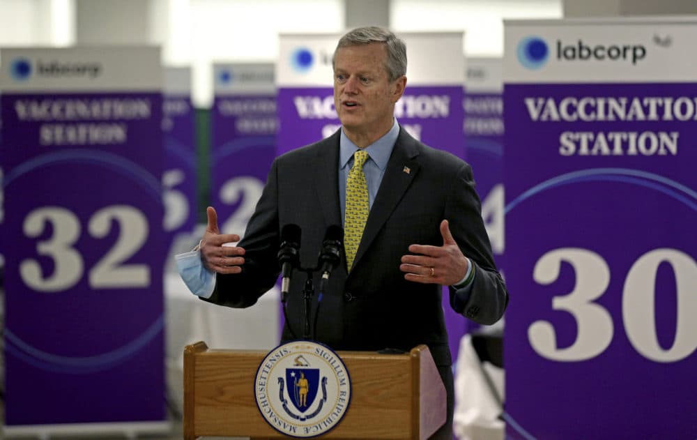 Gov. Charlie Baker speaking at a mass vaccination site at the Natick Mall on Feb. 24. (Matt Stone/The Boston Herald via AP, Pool)