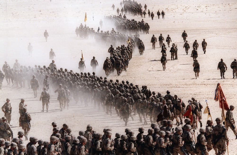 In this Nov. 4, 1990 file photo, responding to Iraq's invasion of Kuwait, troops of the U.S. 1st Cavalry Division deploy across the Saudi desert on during preparations prior to the Gulf War. (Greg English/AP/File)