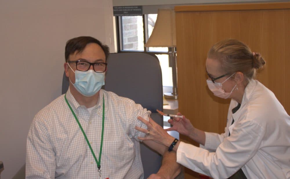 CEO Alexa B. Kimball M.D. administers the COVID-19 vaccine to Dr. Christopher Awtrey, Vice President for Network Operations and Provider Experience at Harvard Medical Faculty Physicians at Beth Israel Deaconess Medical Center in Boston. (Courtesy)