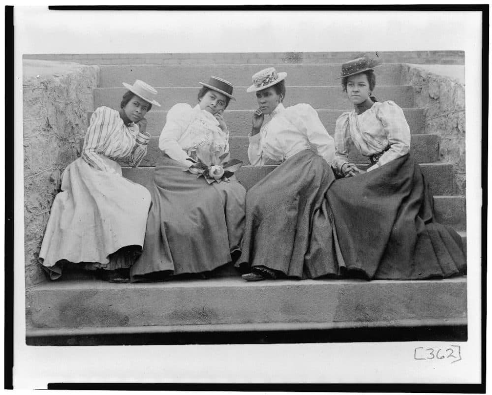 Four African American women seated on steps of building at Atlanta University, Georgia. Photos part of W.E.B. Du Bois award-winning “Exhibit of American Negroes.&quot; (Courtesy of Library of Congress Prints and Photographs Division.)
