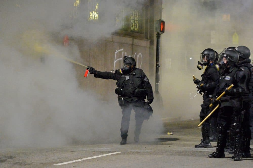 Police shoot pepper spray toward a protester during a demonstration over the death of George Floyd in Boston, Massachusetts, on May 31, 2020. (Joseph Prezioso/AFP via Getty Images)