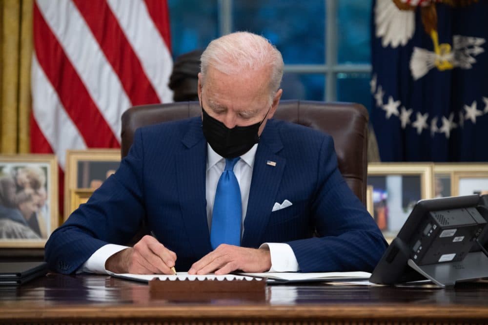 President Biden signs executive orders related to immigration in the Oval Office on Feb. 2, 2021. (Saul Loeb/AFP via Getty Images)