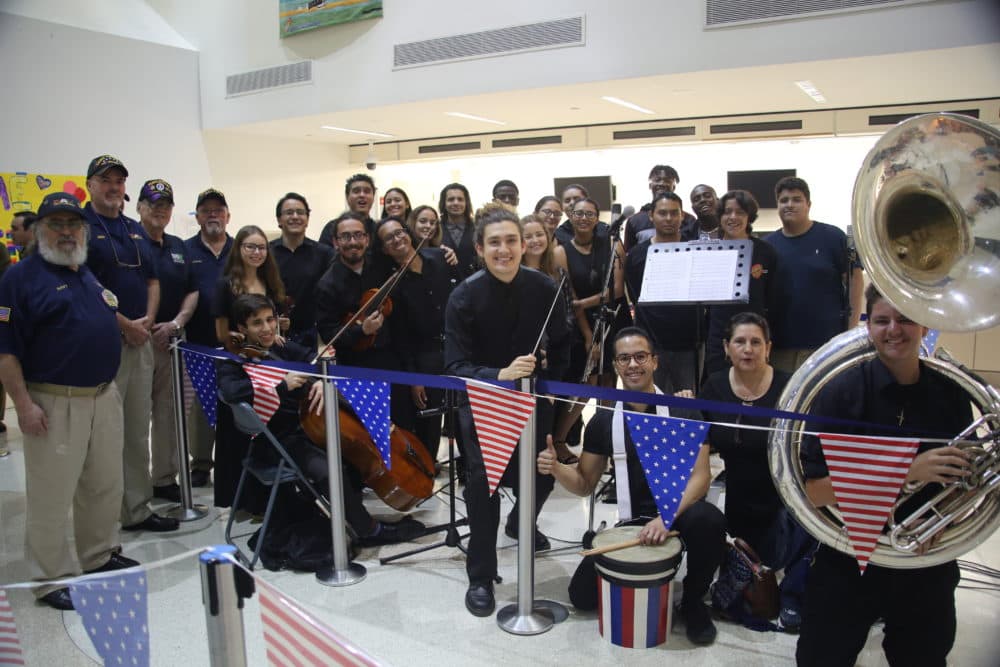 Members of Voices of Freedom playing for WWII, Korea and Vietnam veterans at an Honor Flight South Florida Homecoming Celebration in Miami International Airport. (Courtesy)