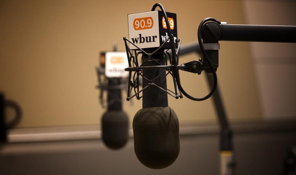 Microphones show the WBUR logo in a studio. (Jesse Costa/WBUR)