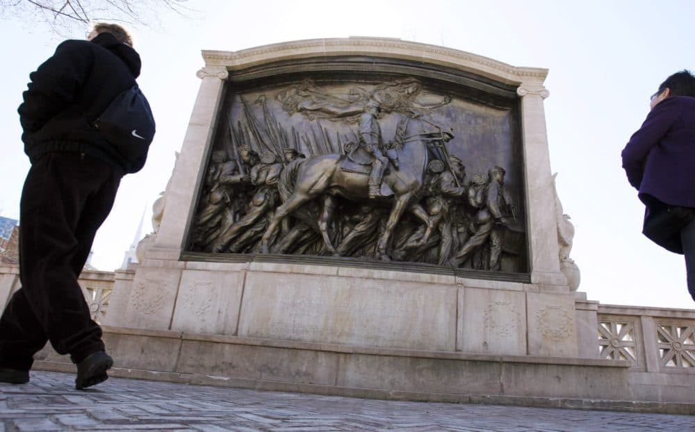 In this March 26, 2011, file photo, people walk past the memorial to Union Col. Robert Gould Shaw and the 54th Massachusetts Volunteer Infantry Regiment, near the State House in Boston. (Michael Dwyer/AP File)