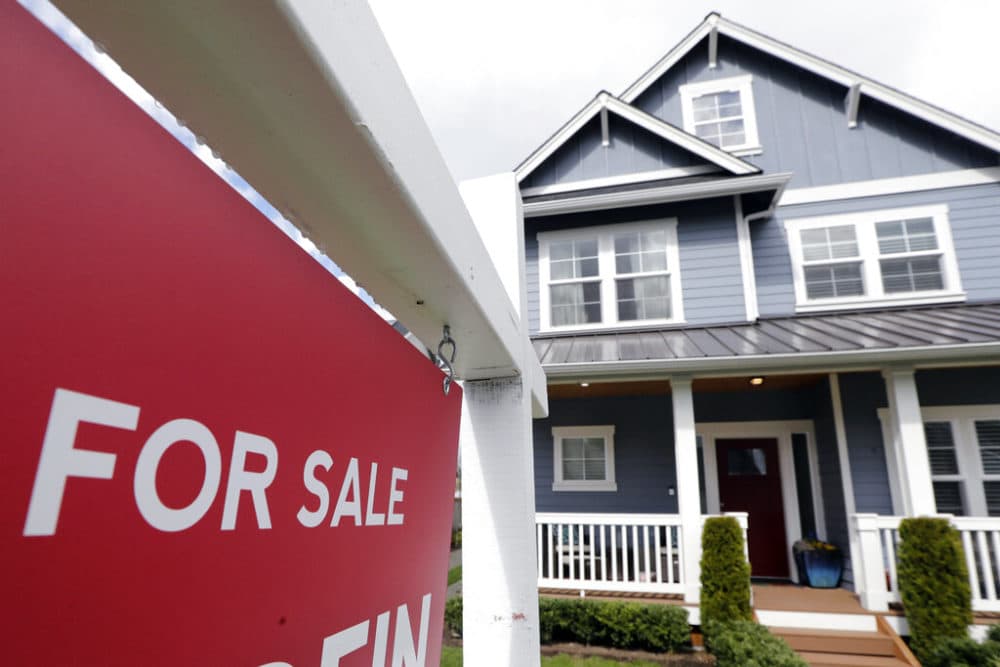 A &quot;For Sale&quot; sign in front of a home. (Elaine Thompson/AP)