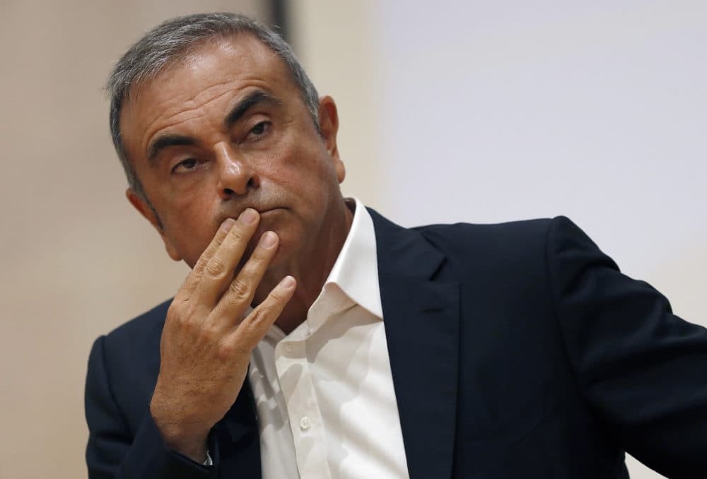 In this Sept. 29, 2020, file photo, former Nissan Motor Co. Chairman Carlos Ghosn holds a press conference. Japanese prosecutors have charged two Massachusetts men, Michael Taylor and his son Peter, in connection with the escape of Ghosn to Lebanon. (Hussein Malla/AP File)