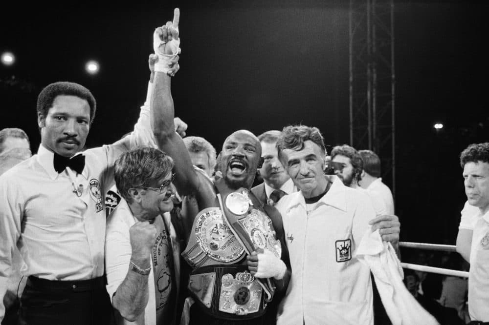 Middleweight Champion Marvelous Marvin Hagler celebrates his undisputed world middleweight Championship with his manager, Pat Petronelli, and Co-Manager, Goody Petronelli on Monday, April 15, 1985 in Las Vegas. Hagler knocked out Thomas &quot;Hitman&quot; Hearns in the third round to clinch the title. (AP Photo)