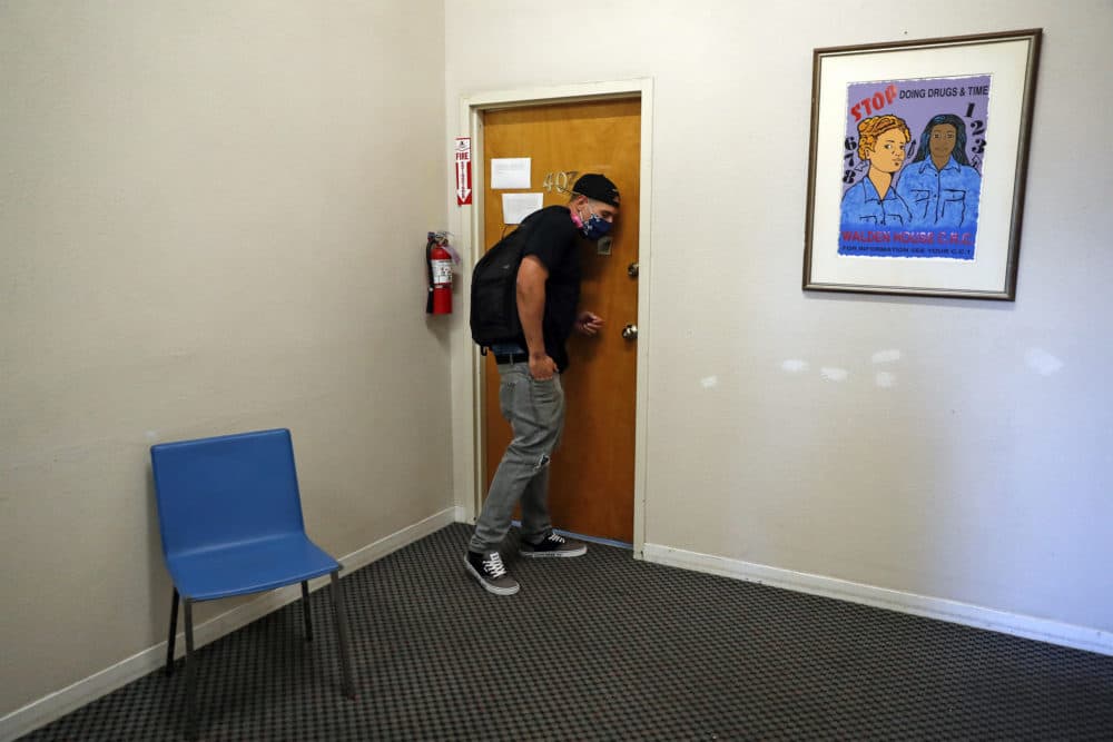 Client Chris Summers listens at a door at Walden House while trying to find his therapist for an appointment at HR360 in San Francisco, Calif., on June 16, 2020. Due to the coronavirus pandemic, those who are homeless or struggling with addiction may find it even harder to find treatment. (Scott Strazzante/The San Francisco Chronicle via Getty Images)