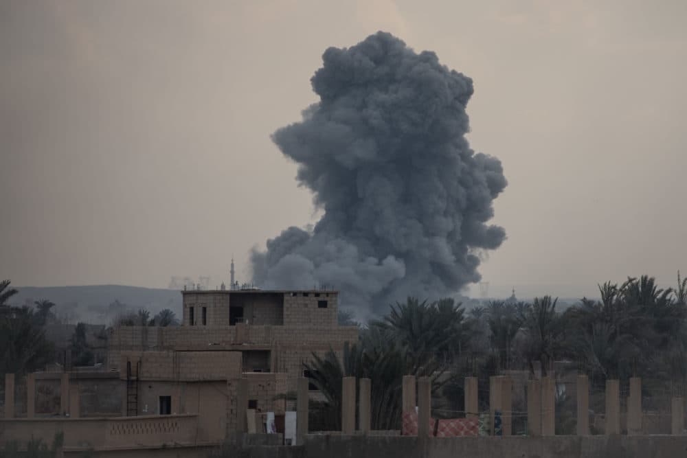 Smoke from a U.S.-led coalition airstrike is seen over buildings near the front line on February 10, 2019 in Bagouz, Syria. (Chris McGrath/Getty Images)