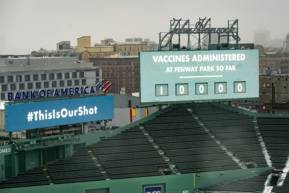 The scoreboard at Fenway Park displays a message that 10,000 vaccines have been administered as the park is opened as a COVID-19 public vaccination site on Feb. 16. The park will be allowed to reopen to fans in phase four. (Billie Weiss/Boston Red Sox/Getty Images)