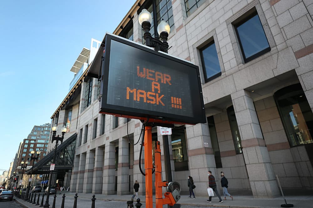 A sign outside the Hynes Convention Center gives instructions to people arriving for vaccines in Boston on March 19, 2021. (Suzanne Kreiter/The Boston Globe via Getty Images)