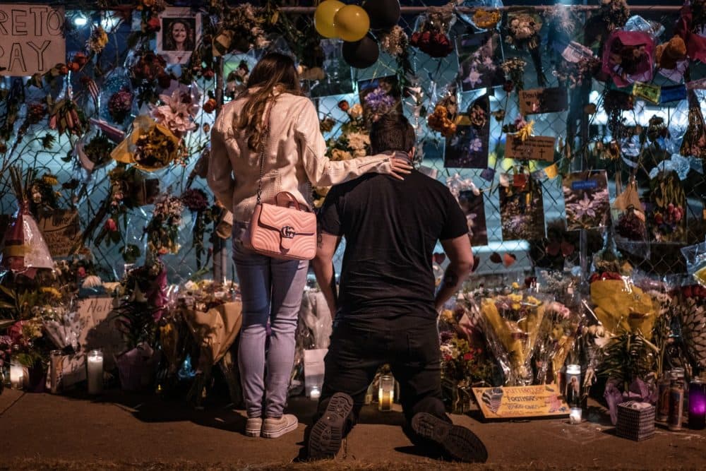 Mourners visit a memorial to those lost in a shooting at a King Soopers grocery store earlier in the week on March 27, 2021 in Boulder, Colorado. (Chet Strange/Getty Images)