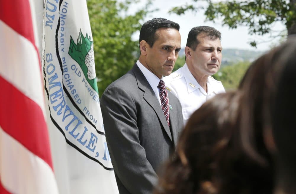 Mayor Joseph Curtatone, left, during a news conference regarding immigration in Somerville in 2014. (Charles Krupa/AP)