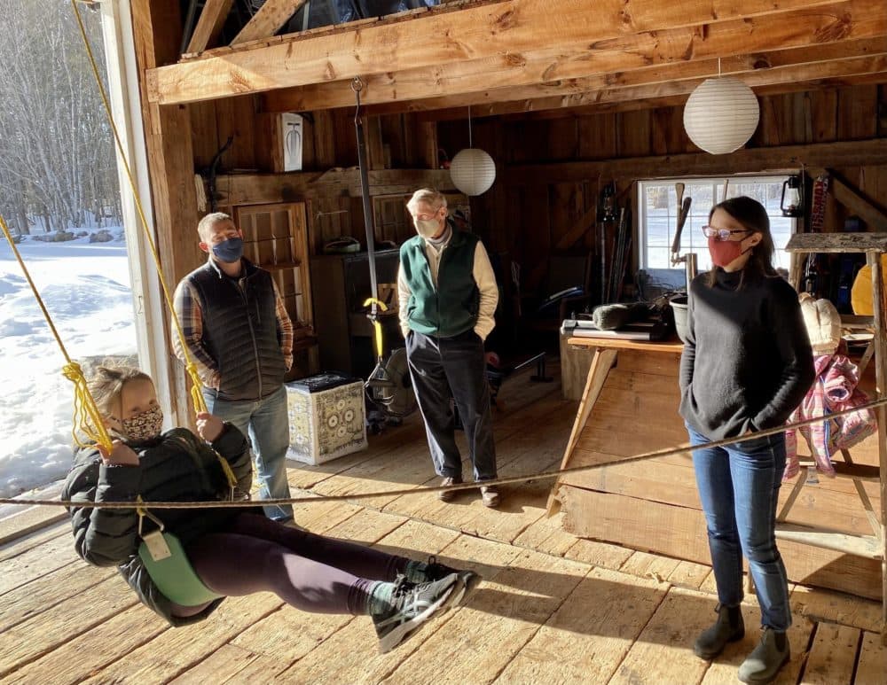 Three generations of the Shelov Hyde family in the barn behind their Sandwich vacation home. (Sarah Gibson/NHPR)