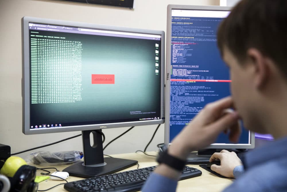 An employee of Global Cyber Security Company Group-IB develops a computer code in an office in Moscow, Russia, Wednesday, Oct. 25, 2017. (Pavel Golovkin/AP Photo)