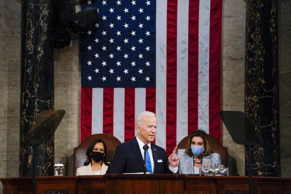 President Joe Biden addresses a joint session of Congress, Wednesday, April 28, 2021, in the House Chamber at the U.S. Capitol in Washington, as Vice President Kamala Harris, left, and House Speaker Nancy Pelosi of Calif., look on. (Melina Mara/The Washington Post via AP)