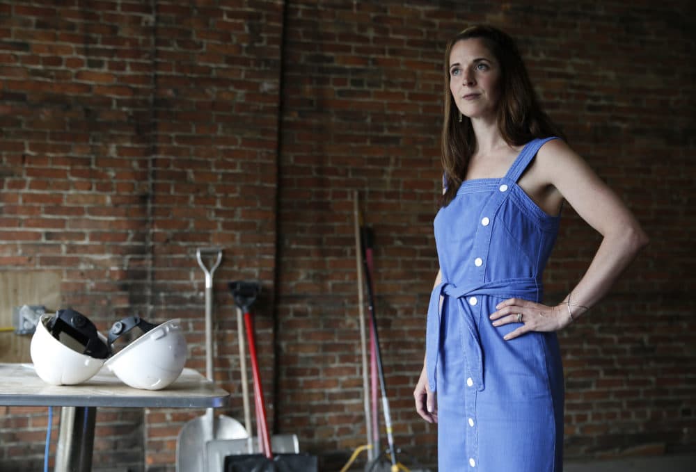 Caroline Pineau, a marijuana entrepreneur, poses for a photo inside the building she was renovating to turn into a pot shop in Haverhill on June 11, 2019. (Jessica Rinaldi/The Boston Globe via Getty Images)