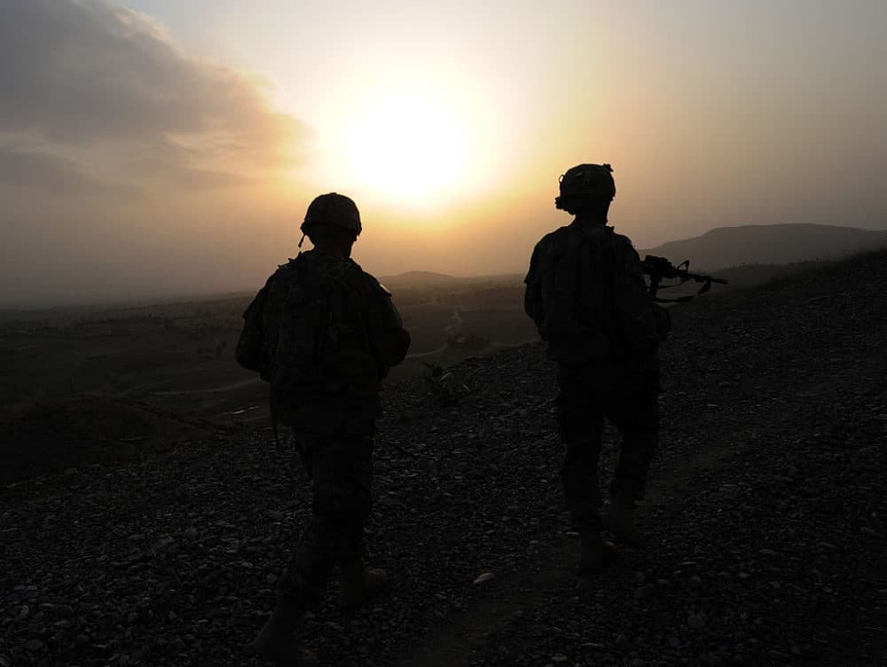 U.S. soldiers from Viper Company (Bravo), 1-26 Infantry are seen during sunset as they conduct a patrol at Combat Outpost Sabari in Khost province in the east of Afghanistan on June 21, 2011. (Ted Aljibe/AFP via Getty Images)