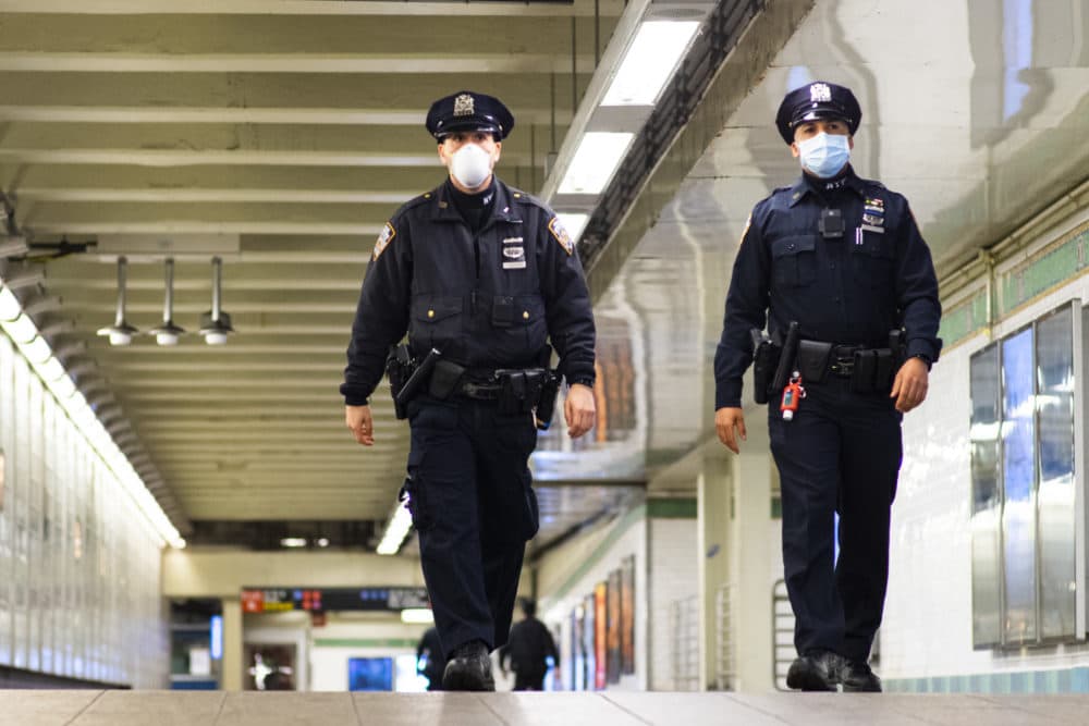 NYPD officers patrol inside Times Square station as the New York City subway system. (Eduardo Munoz Alvarez/Getty Images)