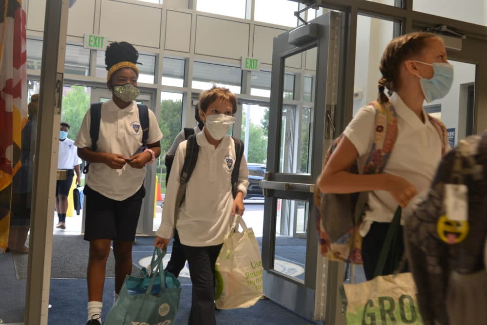 Students enter the first new Catholic school built in Baltimore in roughly 60 years on Monday, Aug. 30, 2021, named after Mother Mary Lange. (David McFadden/AP)