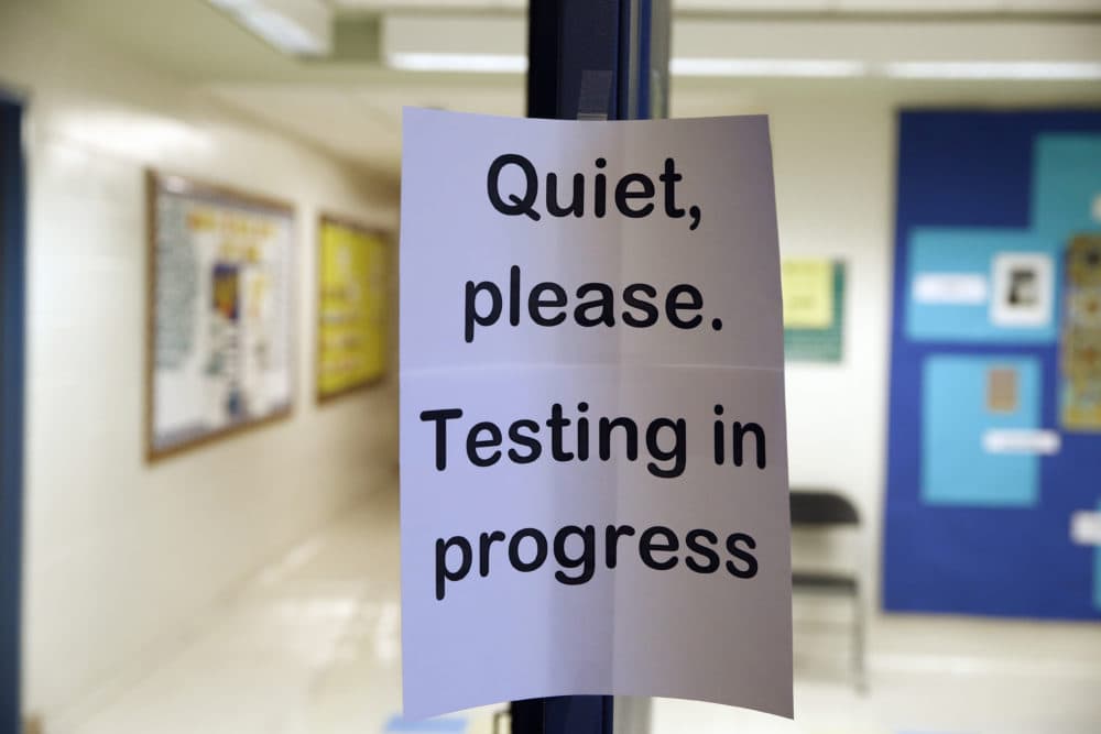 A sign is seen at the entrance to a hall for a college test preparation class. (Alex Brandon/AP)