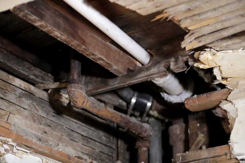 A lead pipe, left, is seen in a hole the kitchen ceiling in the home of Desmond Odom, in Newark, N.J. (Julio Cortez/AP/File)