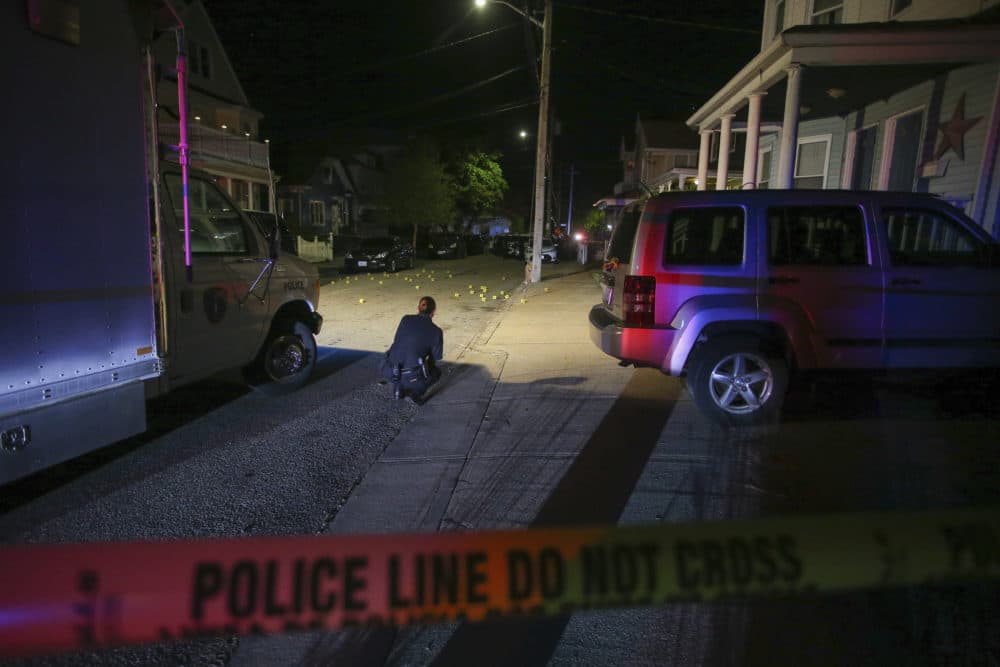 Providence Police investigate a shooting on Carolina Avenue, late Thursday, May 13, 2021, in Providence, R.I. (Stew Milne/AP)