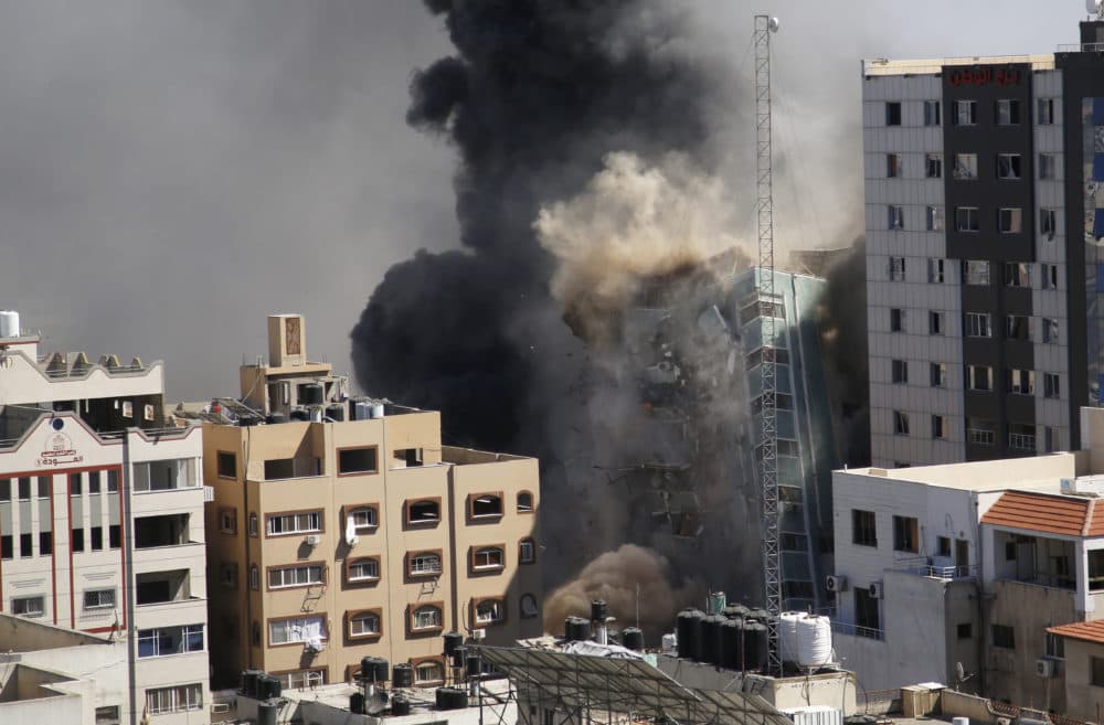 A view of a 11-story building housing AP office and other media in Gaza City is seen moments after Israeli warplanes demolished it, Saturday, May 15, 2021. (Hatem Moussa/AP)