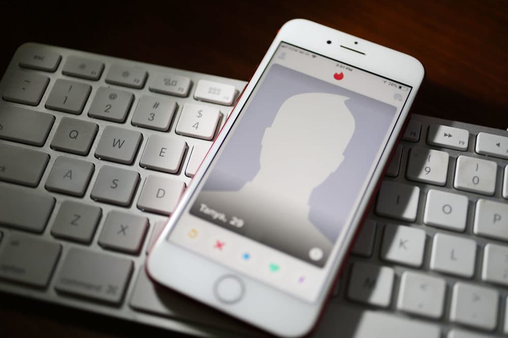 The dating app Tinder is seen on the screen of an iPhone. (Joe Raedle/Getty Images)