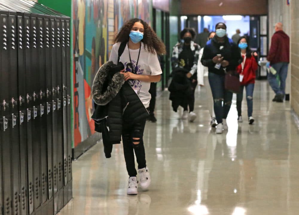 Freshman students walk the hallway in between classes during the bell break, which normally would be packed by students, at Brockton High School in Brockton, Mass. on March 2, 2021. (David L. Ryan/The Boston Globe via Getty Images)
