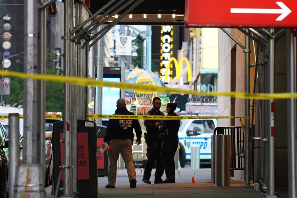 Police officers are seen next to marked shell casings from a gun in Times Square on May 8, 2021 in New York City. According to reports, three people, including a toddler, were injured in the shooting. (David Dee Delgado/Getty Images)