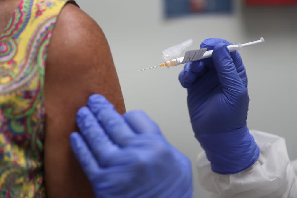 Lisa Taylor receives a COVID-19 vaccination from RN Jose Muniz as she takes part in a vaccine study at Research Centers of America on Aug. 07, 2020 in Hollywood, Florida. (Joe Raedle/Getty Images)